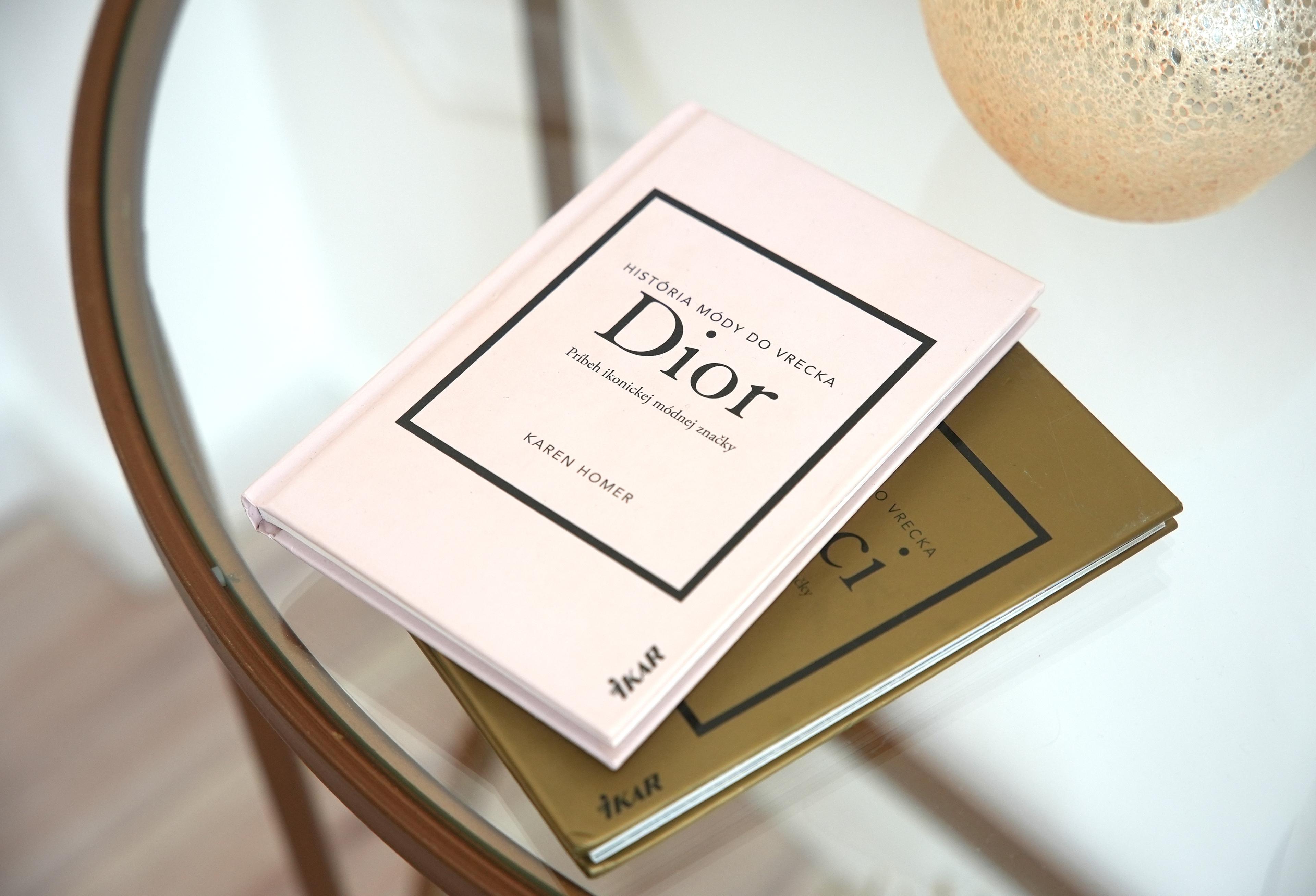 Editorial books and styling detail on the glass table